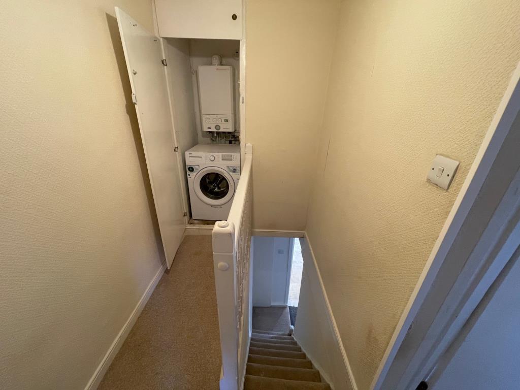 Lot: 107 - TWO-BEDROOM TERRACE HOUSE - Landing with Boiler cupboard